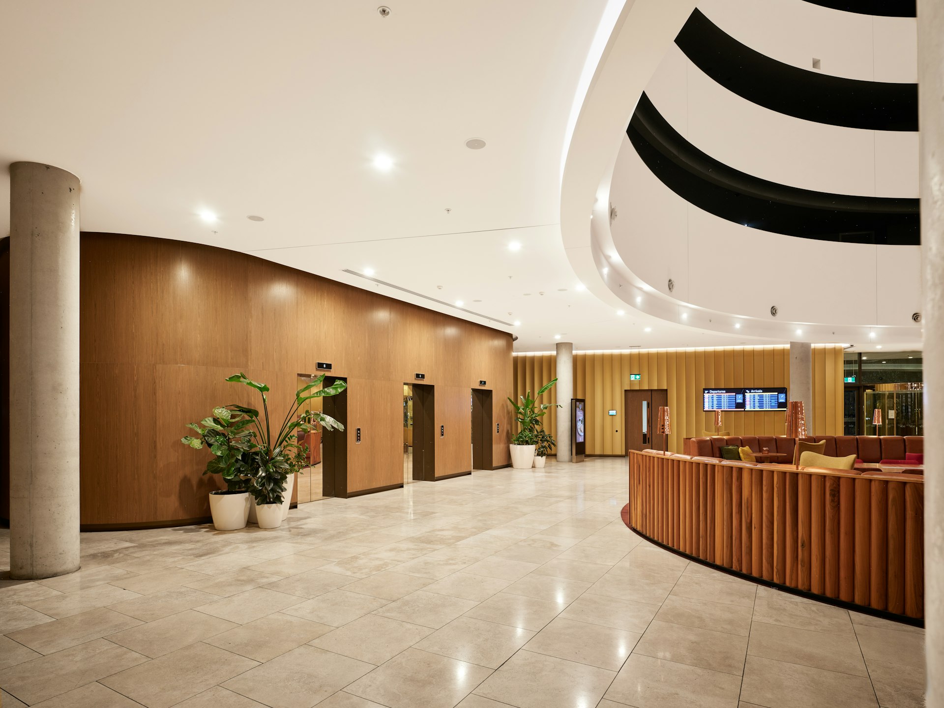 Hotel public corridor with custom-built wall panels and integrated lighting